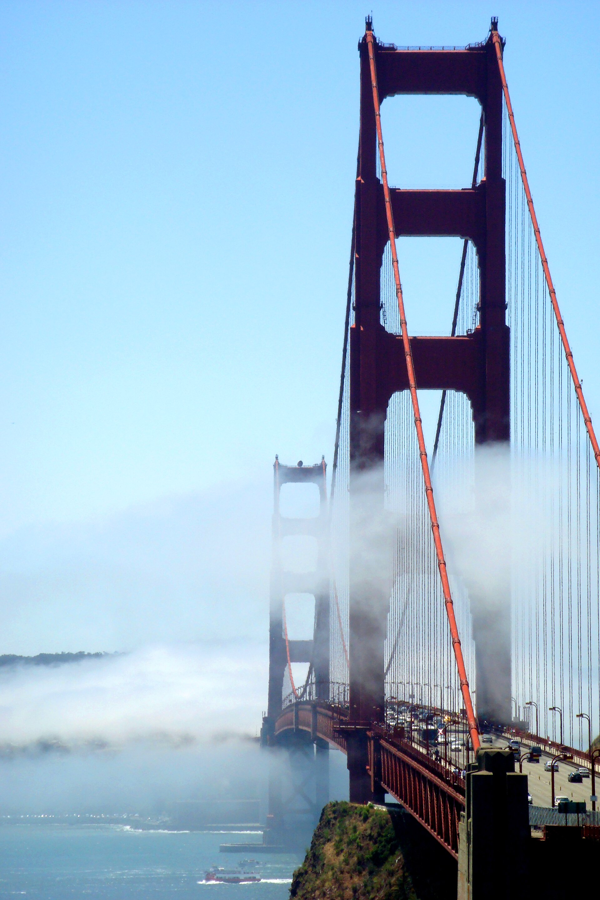 The Golden Gate half-hidden in summer fog